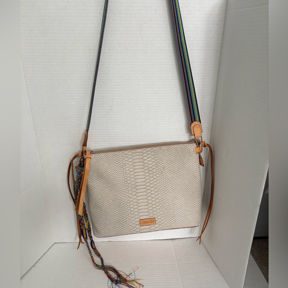 Consuela thunderbird crossbody bag in crema snake embossed exterior